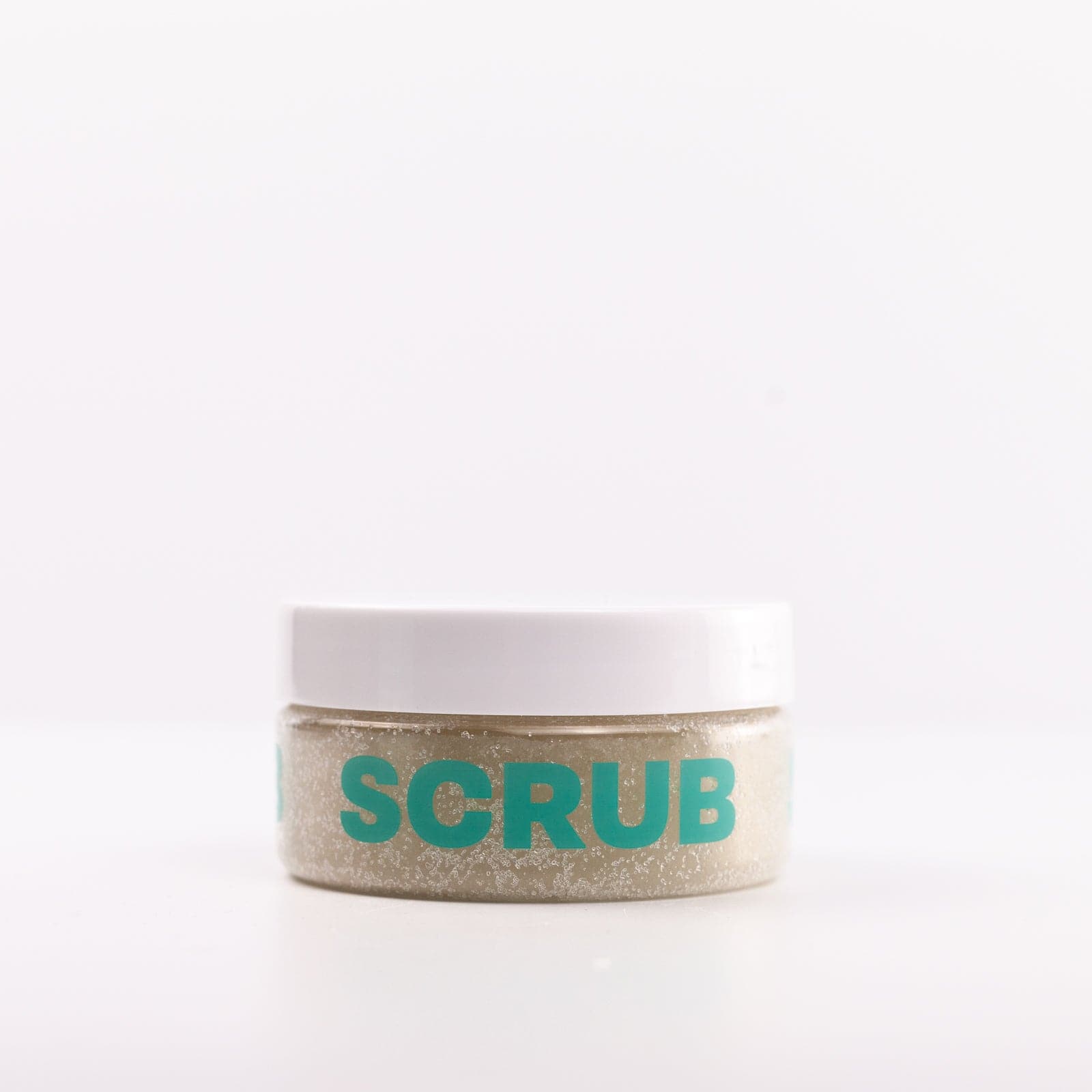 Body Scrub in container with white lid against white background 