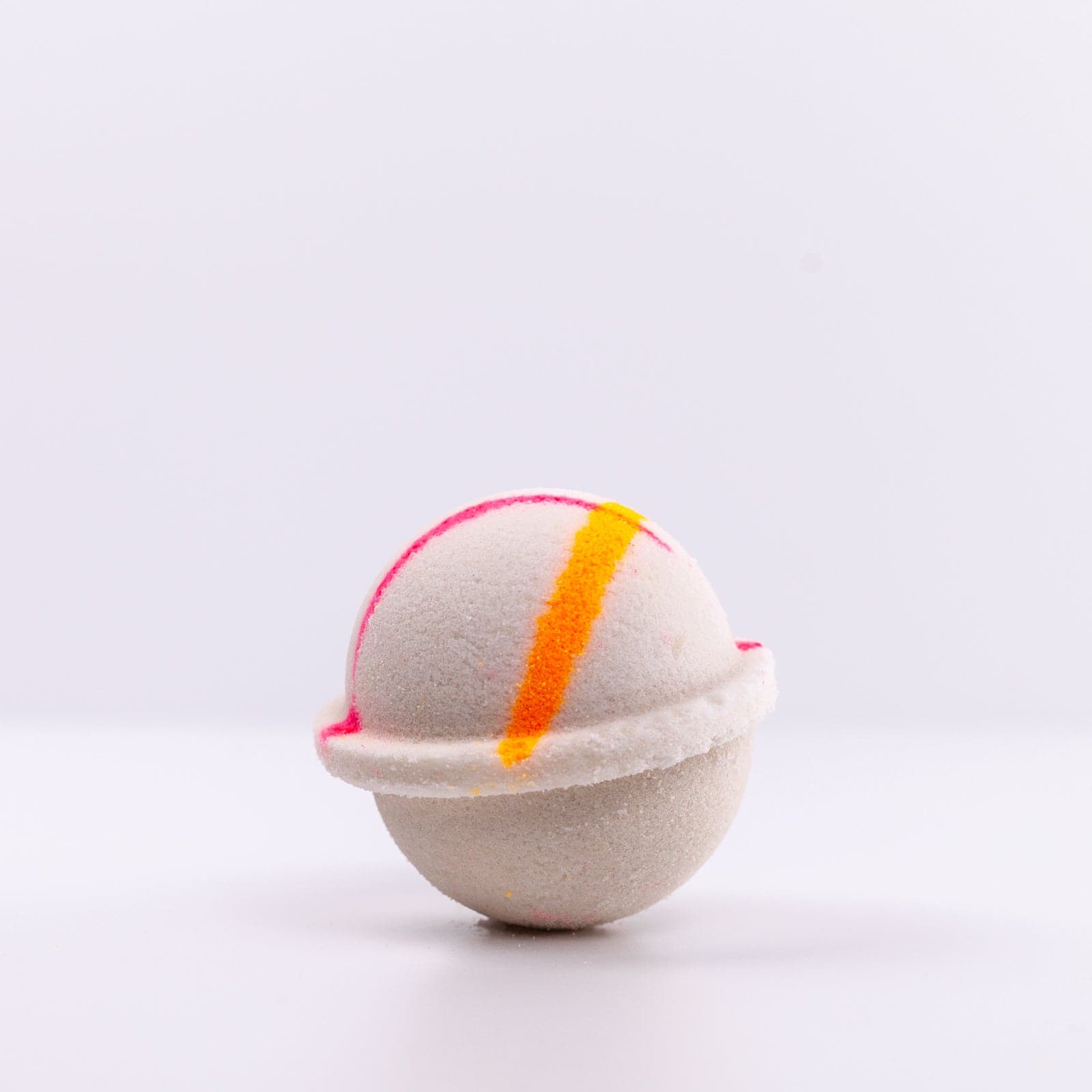 Island Nectar Bath Bomb with pink and yellow design against white background