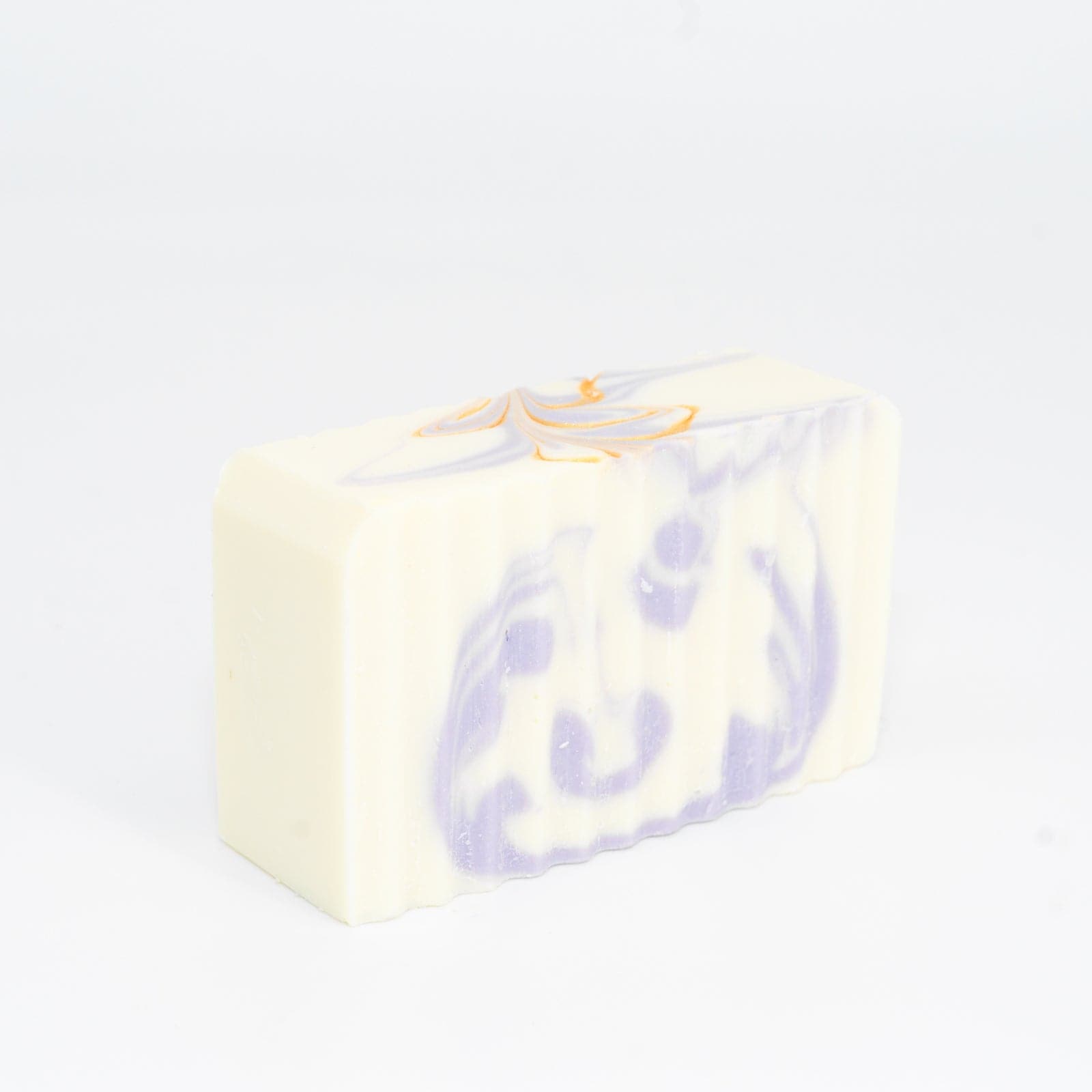 Buff City Soap's lavender scented white shea butter soap with purple and gold highlights