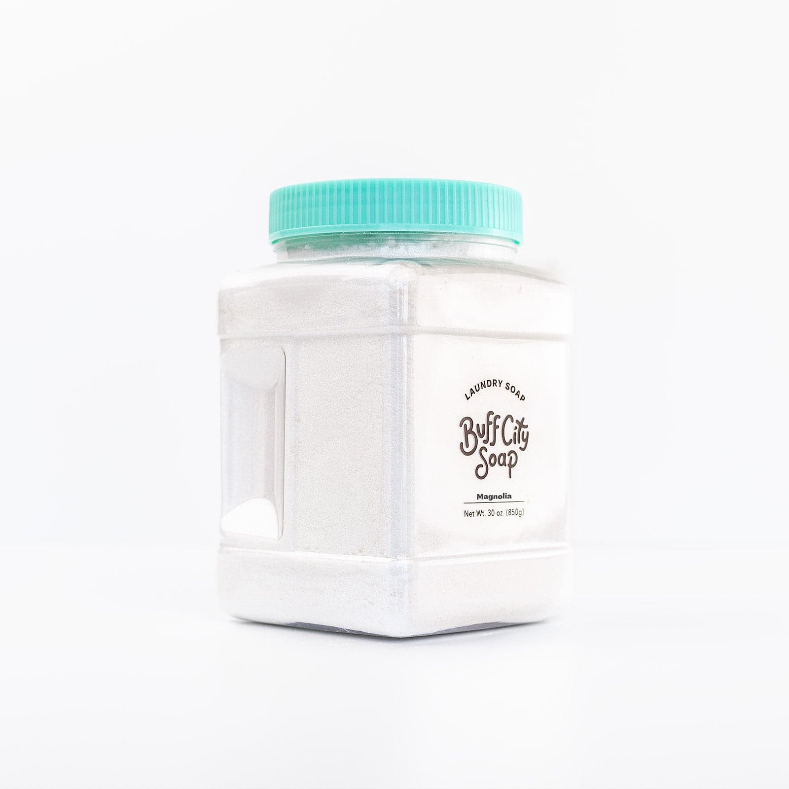 angled right view of clear container of Laundry Soap in the scent Magnolia with teal lid
