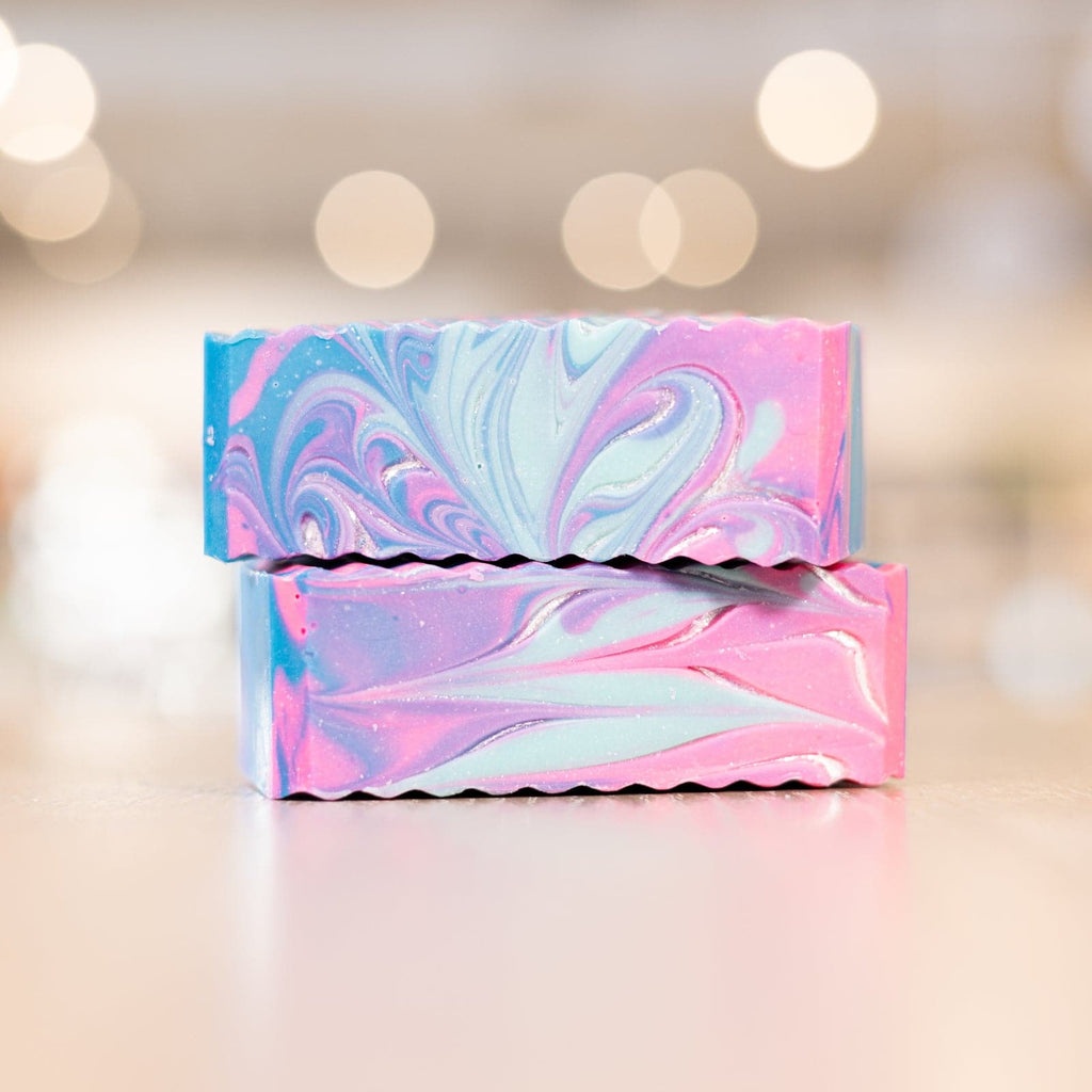 blue, light blue, and pink bars of Mermaid soap stacked on top of each other